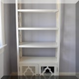 F38. Mirrored bookshelf. 72”h x 30”w x 13”d 